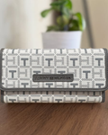 Cartera Tommy Hilfiger color blanco y gris